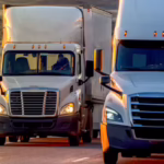 two-used-trucks-on-highway.bvou1xmeg0